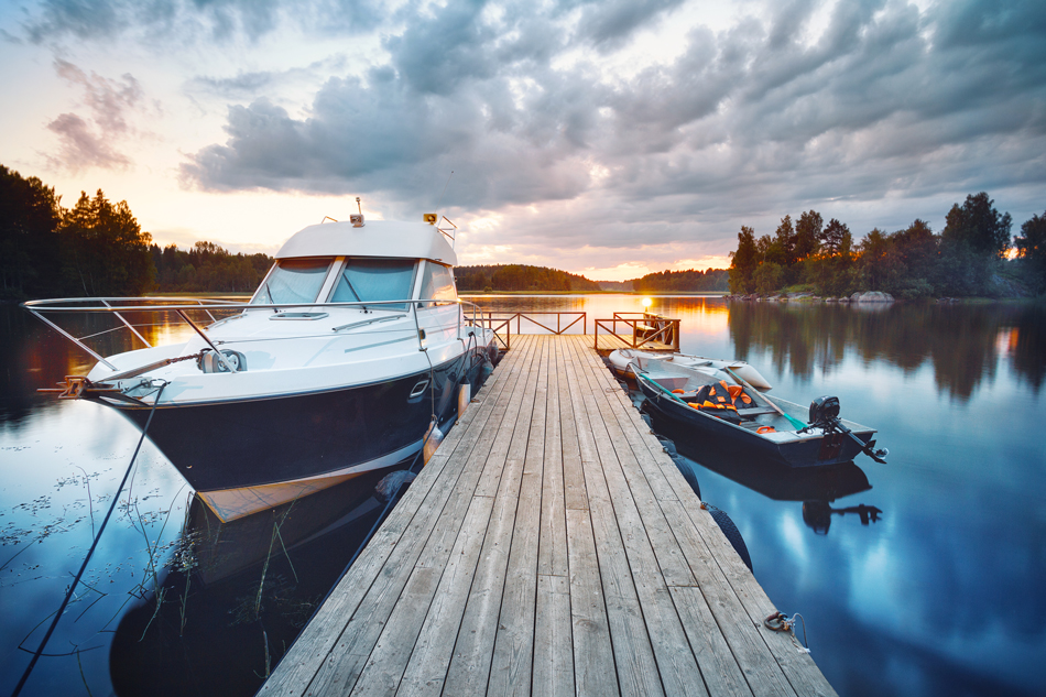 Boat and dingy at a pier